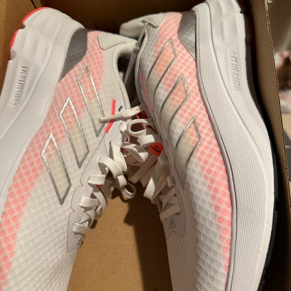 Never worn white pink colors as you can see
